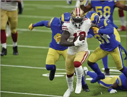  ?? KELVIN KUO — THE ASSOCIATED PRESS ?? 49ers wide receiver Deebo Samuel (19) carries after a catch during the second half against the Rams last Sunday in Inglewood.