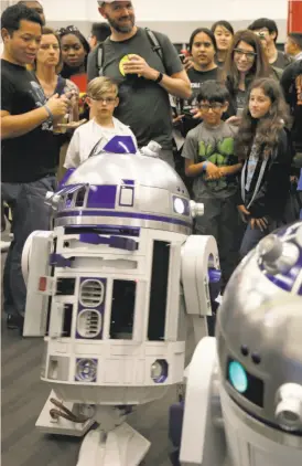  ?? Michael Macor / The Chronicle 2016 ?? R2 Builders, who construct replicas of the “Star Wars” droids, display their creations for the visitors at Silicon Valley Comic Con last year. They will be back.