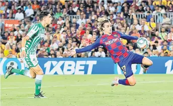  ?? — Reuters photo ?? Barcelona’s Antoine Griezmann scores their first goal.