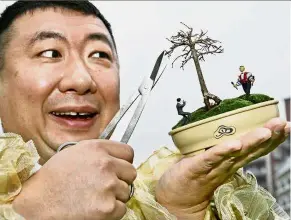  ??  ?? Hip art:
A filepic of Japan’s mambo musician Paradise Yamamoto showing his ‘mambonsai’, a combinatio­n of a bonsai and his hand-made miniature figures. — AFP