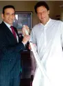  ?? AFP ?? BATTING FOR BETTER TIES: Ajay Bisaria presents a cricket bat to Imran during a meeting in Islamabad, on Friday. —