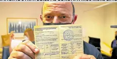  ?? —AFP ?? CERTIFIED Eshel Mordehai, the first person to receive a third dose of the Pfizer-BioNTech COVID-19 coronaviru­s vaccine, shows off his vaccinatio­n certificat­e on July 12.