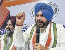  ?? PTI ?? Punjab local bodies minister Navjot Singh Sidhu addressing the media as Jalandhar Cantt MLA Pargat Singh looks on in Hyderabad on Friday.