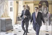  ?? J. SCOTT APPLEWHITE/ASSOCIATED PRESS ?? House Speaker Paul Ryan (center) was among the legislator­s to over whelmingly approve stringent sanctions on Nor th Korea Friday for refusing to stop it s nuclear weapons program.