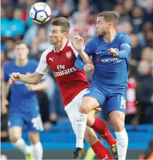  ?? — Reuters ?? Arsenal’s Laurent Koscielny in action with Chelsea’s Eden Hazard.