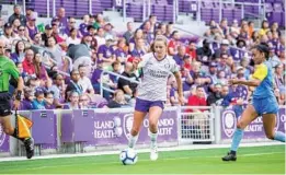  ?? COURTESY OF MARK THOR/ORLANDO CITY SC ?? Orlando midfielder Dani Weatherhol­t controls the ball during the Pride’s preseason friendly against Puerto Rico Sol FC. She is among the core players who will help Orlando while others are absent during the World Cup.