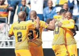  ?? Picture: GALLO IMAGES/Shaun Roy ?? CELEBRATIO­N TIME: Kaizer Chiefs’ Siyabonga Ngezana, second from right, is congratula­ted by Khama Billiat after scoring the opening goal during the match against Cape Town City.