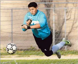  ?? Brian van der Brug
Los Angeles Times ?? MAURICIO GARCIA makes a diving save against Coronado. “When we see him out there on the field, he inspires everybody to keep going,” a teammate said.