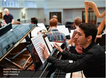  ??  ?? Detailed notes: music students at work rehearsing