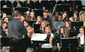  ??  ?? Band director Stephen Pankiewicz led just about 100 grade 10 to 12 students in
the 20th annual St. Francis Xavier High School winter concert on January 15.