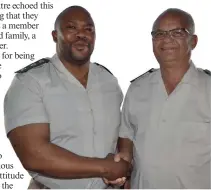  ??  ?? Mr Z Sofuthe (left), the newly-appointed head of the Mossel Bay Correction­al Youth Centre with the former head, Phillip Busch.