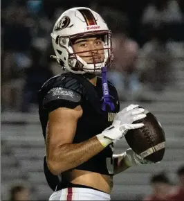  ?? JAMIE SPAAR FOR THE AJC ?? Mill Creek’s Trajen Greco, listed as a cornerback on recruiting boards, has excelled on both sides of the ball. He has 16 catches for 196 yards and five TDS, three carries for 11 yards, and 70 yards on punt returns for the unbeaten Hawks.