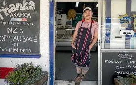  ?? PHOTO: DAVID WALKER/STUFF ?? Brendan Foster, owner and butcher at Akaroa Butchery and Deli, talks about winning NZ’s best sausage award for his venison black pudding.