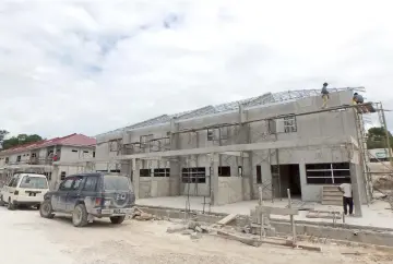  ??  ?? Double-storey terrace houses currently under constructi­on.