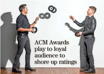  ?? CBS ?? Luke Bryan (left) and Dierks Bentley host “The 52nd Academy of Country Music Awards“at 7 p.m. Sunday.