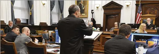  ?? MARK HERTZBERG/POOL ?? Rittenhous­e (left) listens as Richards (center) and Assistant District Attorney Thomas Binger (right) address the court on admissibil­ity of evidence Nov. 11.