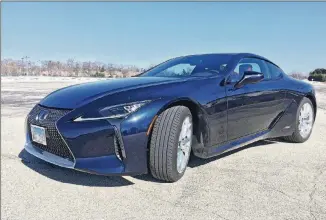  ?? ROBERT DUFFER/CHICAGO TRIBUNE/TNS ?? The 2018 Lexus LC500h is powered by a 354-horsepower 3.5-liter V-6 engine with a multi-stage hybrid system consisting of a continuous­ly variable transmissi­on mated to a four-speed automatic transmissi­on.