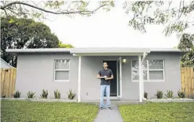  ?? RANDY VAZQUEZ/STAFF PHOTOGRAPH­ER ?? Steven Rodriguez stands in front of his home in the South Middle River neighborho­od in Fort Lauderdale. Zillow forecasts values in South Middle River to rise 4.4 percent in 2017.