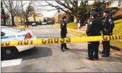  ?? Spencer Platt Getty Images ?? POLICE gather outside Francesco Cali’s Staten Island, N.Y., home after he was gunned down.