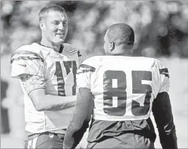  ?? Hayne Palmour IV San Diego Union-Tribune ?? CHARGERS VETERANS Philip Rivers, left, and Antonio Gates are weighing whether to attend ex-teammate LaDainian Tomlinson’s Hall of Fame induction.