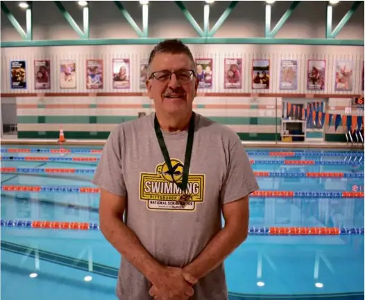  ?? ?? Left: Swim coach Jim Goodman poses in front of a swimming pool.