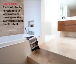  ??  ?? BATHROOM A mix of tiles by Porcelanos­a in warm natural tones gives the bathroom a light, timeless feel