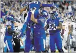  ?? Bryan Woolston ?? The Associated Press Kentucky running back Benny Snell Jr. (26) is hoisted in celebratio­n after his touchdown against Mississipp­i State on Saturday.