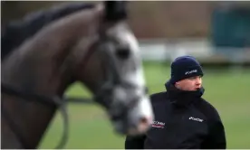  ??  ?? Gordon Elliott said a photograph showing him sitting on a dead horse was ‘a moment of madness’. Photograph: Simon Cooper/PA