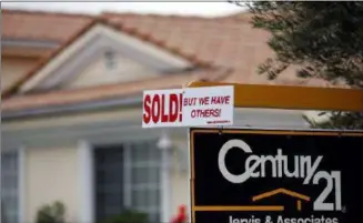  ?? FILE PHOTO ?? A real estate sign is seen outside a home.