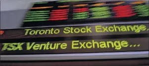  ?? CP PHOTO ?? The TSX ticker is shown in Toronto on May 10, 2013. While stabilizin­g oil prices helped Canadian equities break out their doldrums in the second half of 2017, investors expecting the Toronto Stock Exchange to catch up with its outperform­ing global...