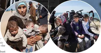  ?? ?? DESPERATE A mother with her three children fleeing the al-shifa war zone