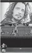  ?? TED S. WARREN, AP ?? A tribute to singer Chris Cornell adorns a video display at Safeco Field in Seattle.