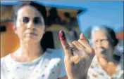  ??  ?? A woman shows her inkstained finger after casting her VOTE.REUTERS