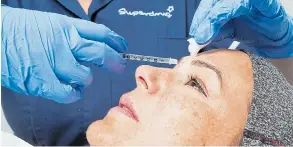  ?? Picture: DAVID BARRY /PA ?? A patient receives a cosmetic treatment injection at Superdrug yesterday