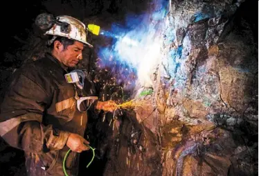  ?? — afp ?? Production glitch: a Chilean miner places explosives inside the Kiara copper mine south of antofagast­a. The commodity has risen 8.2% this year, driven largely by concerns about risks to supply.