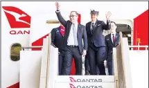  ??  ?? In this photo provided by Australian airliner Qantas, Qantas CEO Alan Joyce and flight crew disembark the Boeing 787-9 Dreamliner as the plane
landed at Sydney airport in Sydney, Friday, Nov. 15, 2019. (AP)