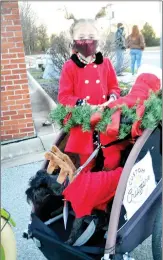 ??  ?? Children, pups, Santa were an integral part of the annual Pea Ridge Christmas Parade the first Saturday of December.