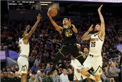  ?? RAY CHAVEZ — BAY AREA NEWS GROUP ?? Golden State Warriors' Jordan Poole (3) makes a shot against the Denver Nuggets in the first quarter of Game 1of their first round playoff series at Chase Center in San Francisco on Saturday.