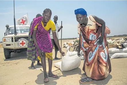  ??  ?? Clockwise from top: Two African women prepare to carry a sack of seeds, Mike Robinson and Kwasi Kwarteng.