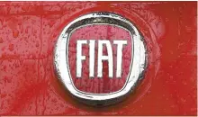  ?? AP-Yonhap ?? A Fiat logo pictured on a car in Milan, Italy, in this Jan. 2, 2014 file photo.
