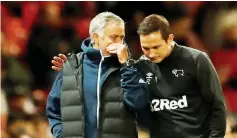  ??  ?? Manchester United manager Jose Mourinho speaks with Derby County manager Frank Lampard. — Reuters photo