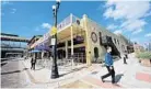  ?? RICARDO RAMIREZ BUXEDA/STAFF PHOTOGRAPH­ER ?? The Exchange sale includes the building that houses Lion’s Pride Soccer Pub & Grille.