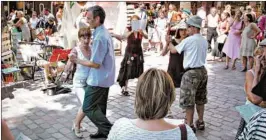  ?? RICK STEVES/RICK STEVES’ EUROPE ?? Bastille Day block parties bring locals and tourists together for music and dancing.