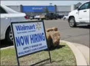  ?? THE ASSOCIATED PRESS ?? A sign in the parking lot of a Walmart in Oklahoma City, announces that the store is hiring.