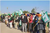  ?? — PTI ?? Farmers during their protest on the GT Karnal Road near the Singhu border in New Delhi on Tuesday.