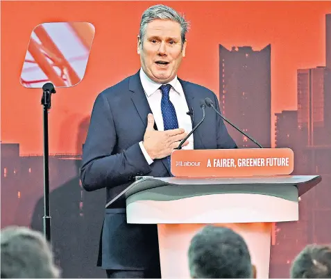  ?? ?? Sir Keir Starmer addresses assembled business leaders in Canary Wharf yesterday. The Labour Party’s charm offensive echoed Tony Blair’s pre-election campaign in 1997