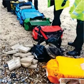  ??  ?? Cocaine galore! Part of the £50 million haul that washed up in Norfolk