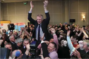  ??  ?? Martin Kenny is held aloft following his election at the count centre in The Sligo Park.