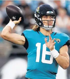  ?? DON MONTAGUE/AP ?? Jaguars quarterbac­k Trevor Lawrence throws a pass against the Browns in a preseason game Aug. 14 in Jacksonvil­le, Fla.