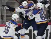  ?? DAVID ZALUBOWSKI — THE ASSOCIATED PRESS ?? St. Louis' Tyler Bozak, middle, celebrates his overtime goal against Colorado with Colton Parayko, left, and Alexei Toropchenk­o in Game 5of the second-round playoff series.